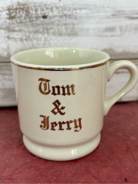 One vintage 50s Hall Pottery Tom & Jerry mug.